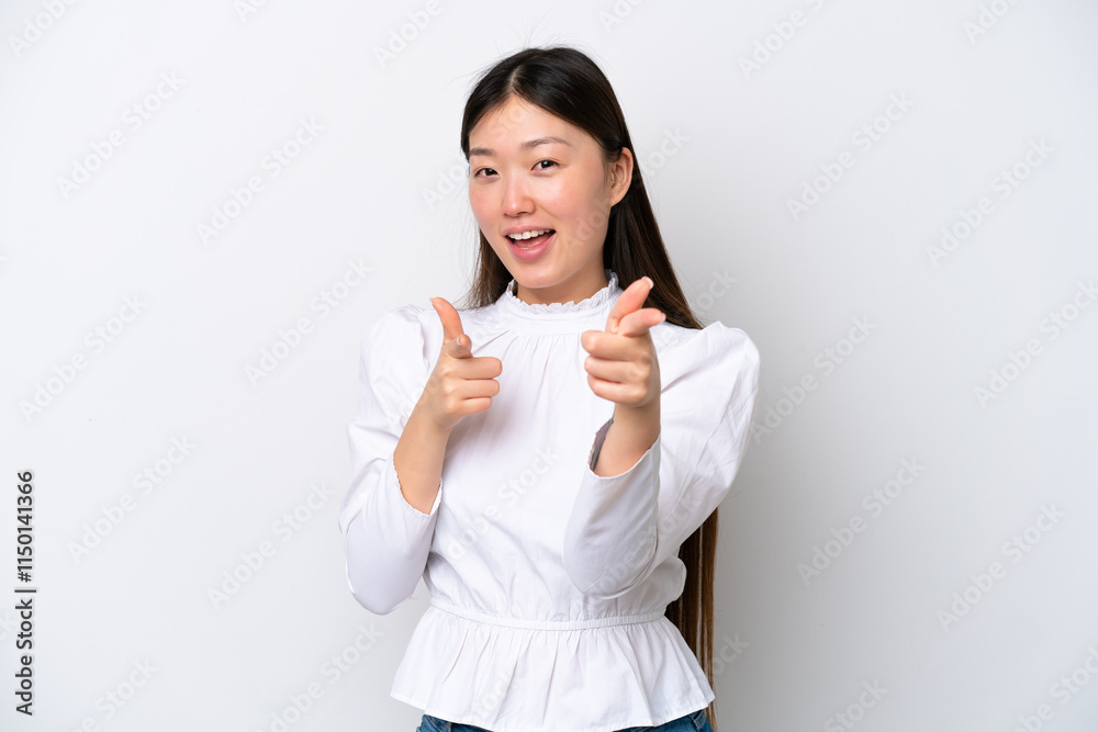 Young Chinese woman isolated on white background surprised and pointing front Young Chinese woman isolated on white background surprised and pointing front