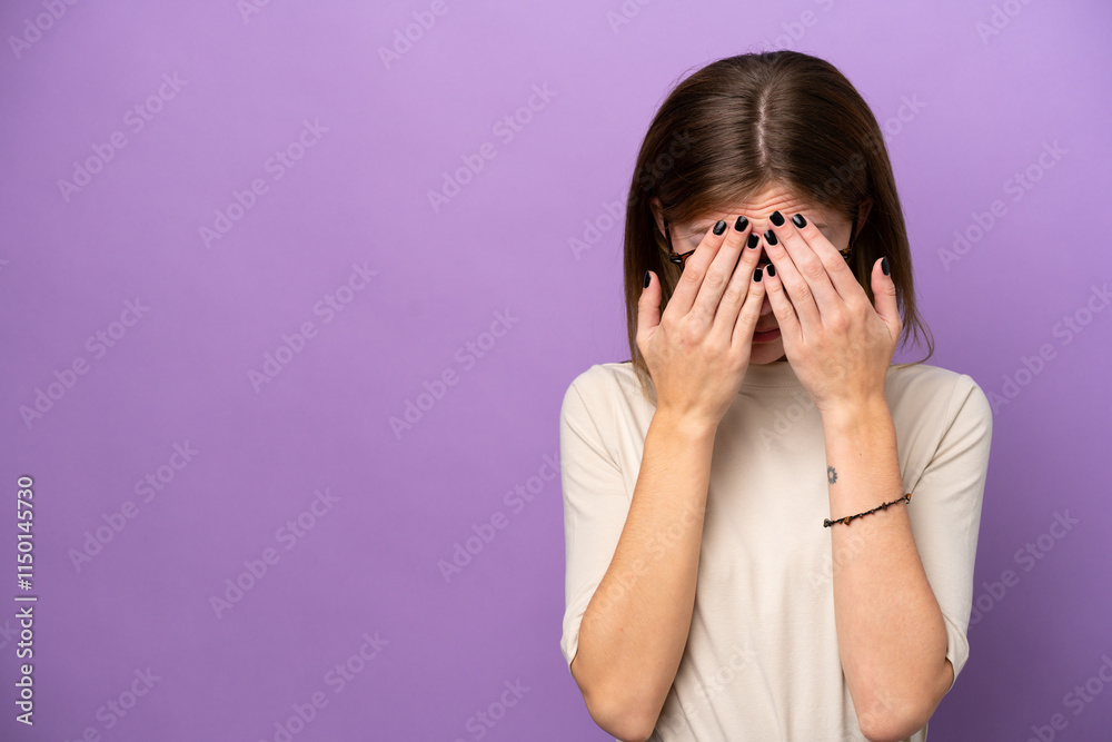 Young English woman isolated on purple background with tired and sick expression Young English woman isolated on purple background with tired and sick expression