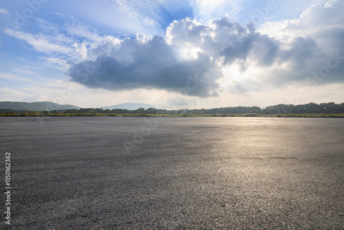 Obraz na płótnie Asphalt road square and sky clouds nature background. Outdoor asphalt parking lot. w salonie