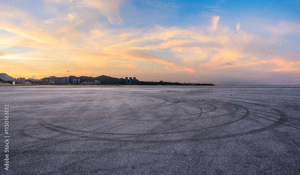 Asphalt road square and coastline with beautiful sky clouds nature landscape at sunset. Outdoor asphalt parking lot.