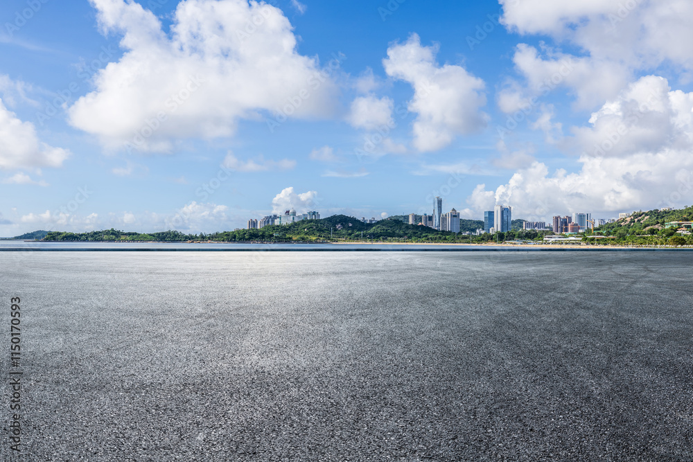 Asphalt road square and city skyline with island scenery in Zhuhai, China. Outdoor asphalt parking lot.