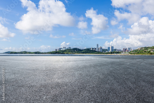 Asphalt road square and city skyline with island scenery in Zhuhai, China. Outdoor asphalt parking lot.