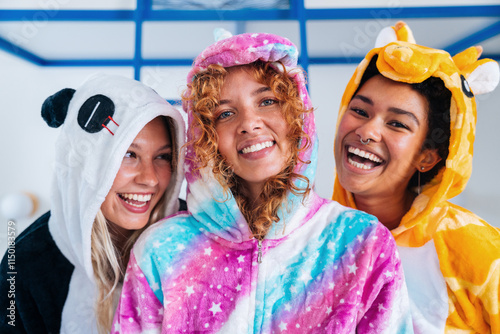 Multiethnic group of young female friends having pajamas party at home