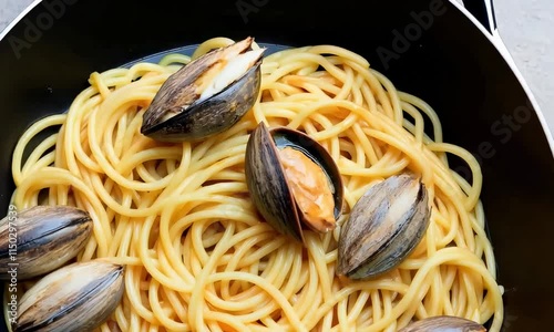 Delicious Spaghetti with Clams in Garlic Butter Sauce - Perfect for Italian Night or Gourmet Dinner photo