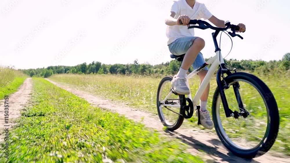 boy riding a bicycle in the park boy riding a bicycle in the park