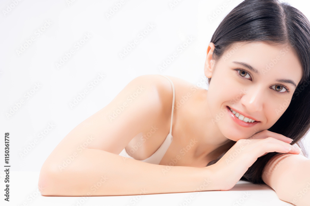 Portrait young woman with long dark hair, smiling warmly while resting her arms on a white surface against a bright, minimalistic background. Perfect for themes of beauty, wellness and positivity. Portrait young woman with long dark hair, smiling warmly while resting her arms on a white surface against a bright, minimalistic background. Perfect for themes of beauty, wellness and positivity.