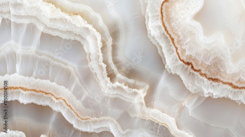 Close-up of white and beige onyx stone texture with swirling patterns.