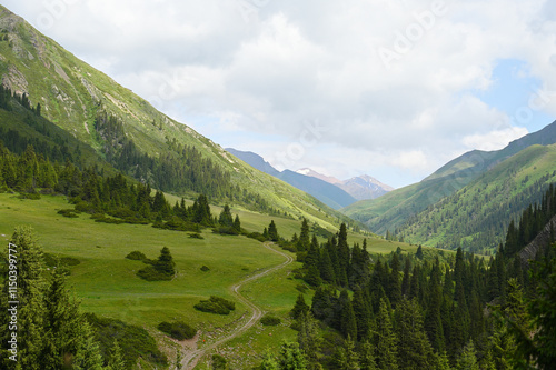 Mountains views of meadows and rivers on a summer cloudy day , Kazakhstan, Kegen, Aktas mount, Tekes river.