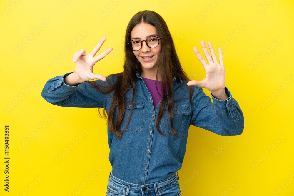 Young French woman isolated on yellow background counting eight with fingers Young French woman isolated on yellow background counting eight with fingers