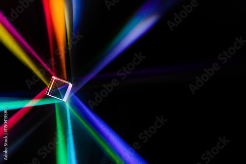 Obraz na płótnie A glass dichroic prism disperse light into different colors on a black background w salonie