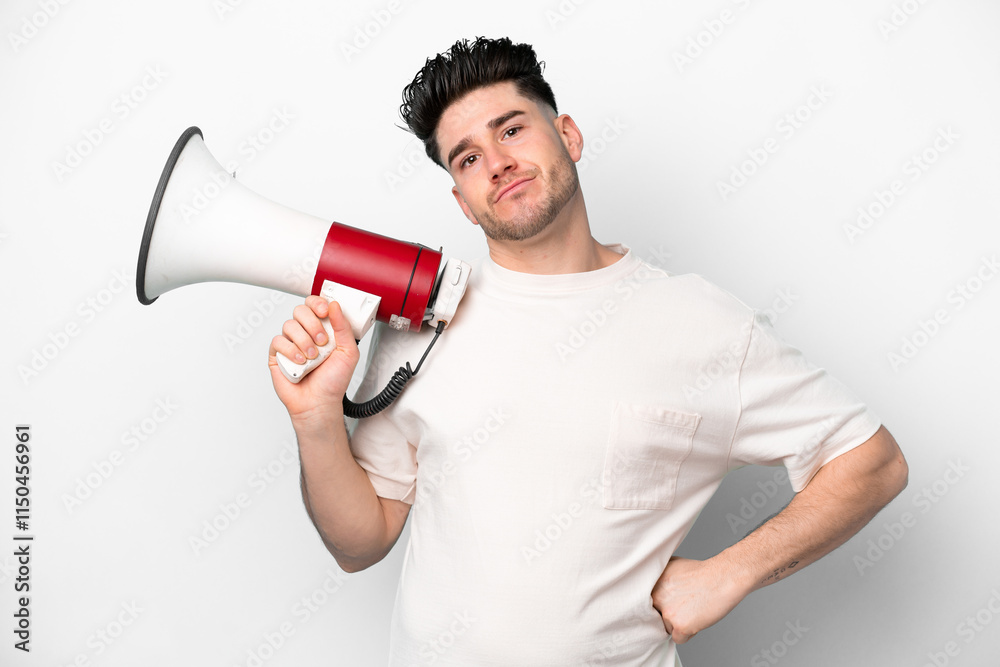 Young caucasian man isolated on white background holding a megaphone and thinking Young caucasian man isolated on white background holding a megaphone and thinking