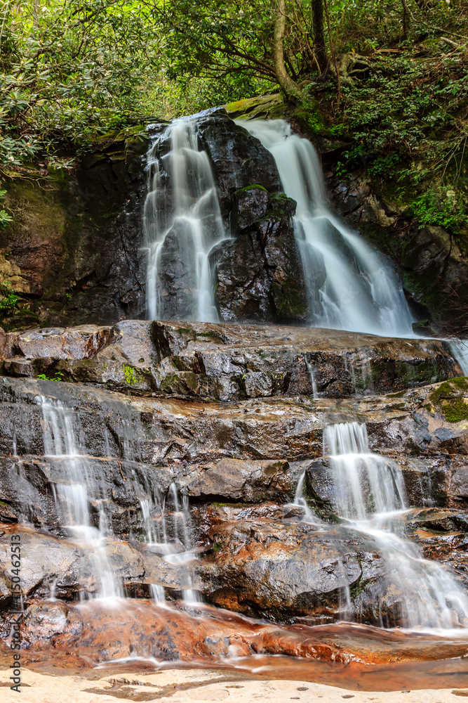 Fototapeta premium A waterfall with a lot of water coming out of it