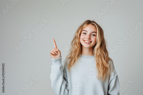 Young pretty blonde woman over isolated white background pointing up