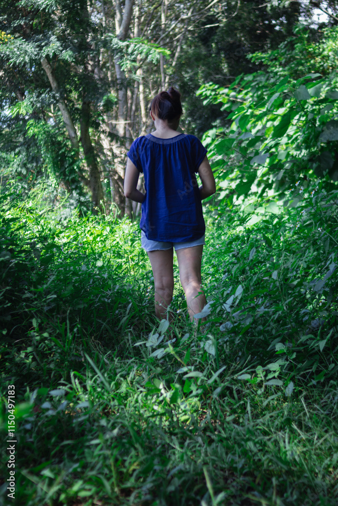 woman walking forward on the path to her intended destination and her journey along the path is a good exercise. feet walking along the path is the concept of walking to her destination and success. woman walking forward on the path to her intended destination and her journey along the path is a good exercise. feet walking along the path is the concept of walking to her destination and success.
