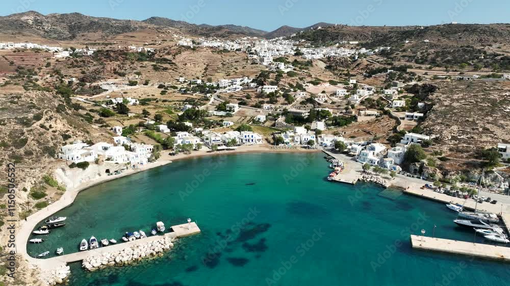 Aerial drone cinematic video of small port of Psathi untouched by tourism built below picturesque hora of Kimolos island, Cyclades, Greece Aerial drone cinematic video of small port of Psathi untouched by tourism built below picturesque hora of Kimolos island, Cyclades, Greece