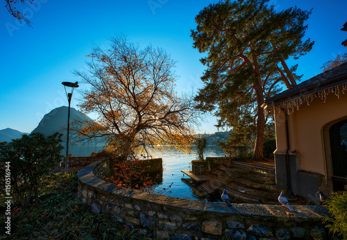 Tranquil afternoon on the lake surronded by mountains photo