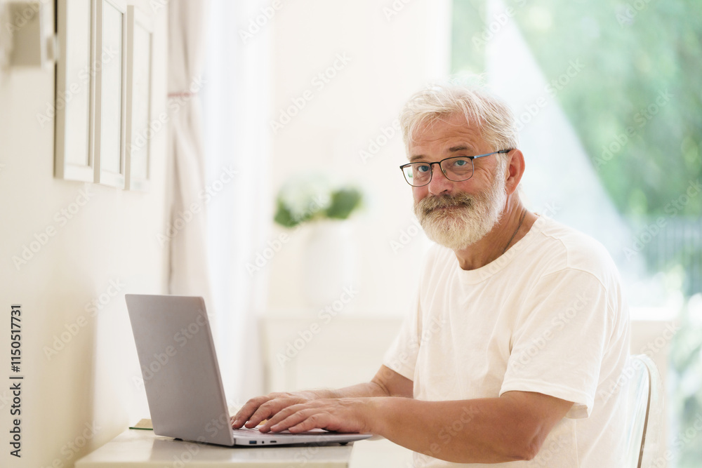 Senior man working on computer Senior man working on computer