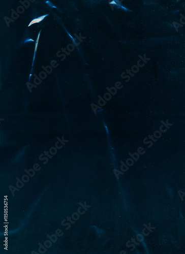 Old film overlay. Creased foil texture. Blue white color light flare dust scratch particles defect weathered crumpled effect worn filter teal dark illustration art abstract background.