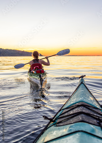 Recreational Canoeing at Sunset on Calm Waters in Vancouver #1150555197