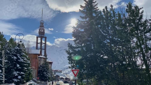Winter footage of the mountains, ski pistes, snowy slopes in Les 3 Vallees in France. Skiing and snowboarding in the Alps.
