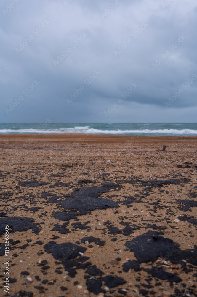 Fuel oil stains on the Black Sea coastline. Environmental disaster, environmental pollution. Oil spill Fuel oil stains on the Black Sea coastline. Environmental disaster, environmental pollution. Oil spill