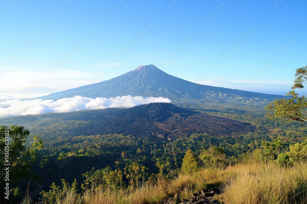 Fototapeta premium Majestic Twin Volcanic Peaks Rise Above Cloudscape
