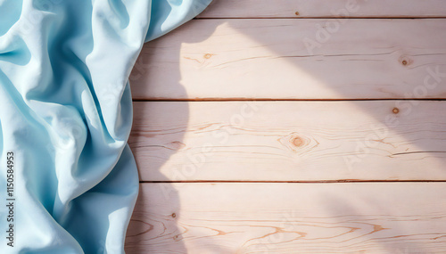 A light blue fabric draped over a wooden surface, with dark blue fabric draped over a marble surface.