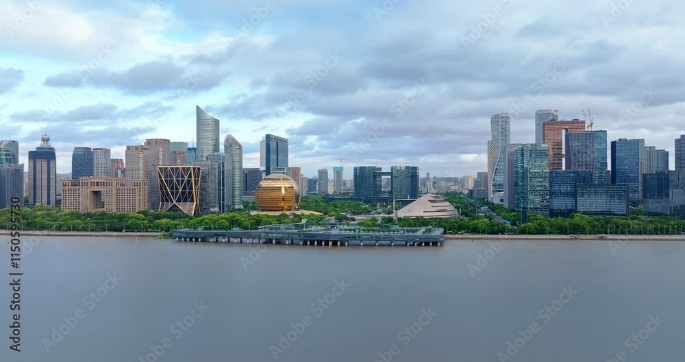 Aerial shot of modern city buildings skyline and river at sunrise in Hangzhou, China Aerial shot of modern city buildings skyline and river at sunrise in Hangzhou, China