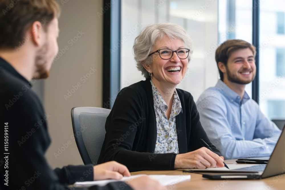 Business professionals engaged in lively, positive conversation during meeting. Mature HR manager hold job interview with applicant, smile, lead talk gathered at conference desk. Briefing, negotiation