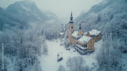 St. Primoz church near kamnik stands in the snowy valley during winter photo