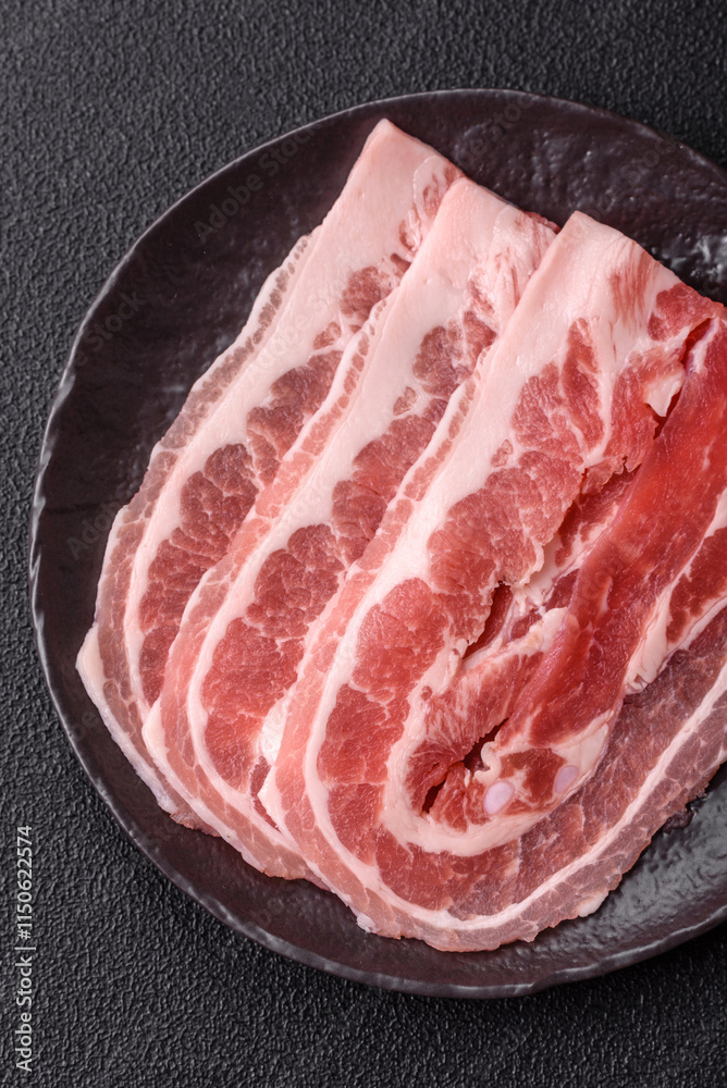 Fresh raw bacon sliced with spices and herbs