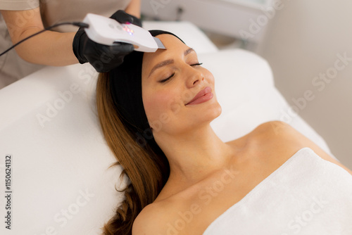 Revitalizing facial cleansing and ultrasonic massage for glowing skin during a tranquil spa session