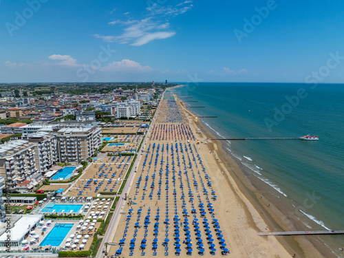 Italy, Jesolo near Bibione. Lido di Jesolo, or Jesolo Lido, is the beach area of the city of Jesolo in the province of Venice, Aerial View with sandy beach and with an endless parasols