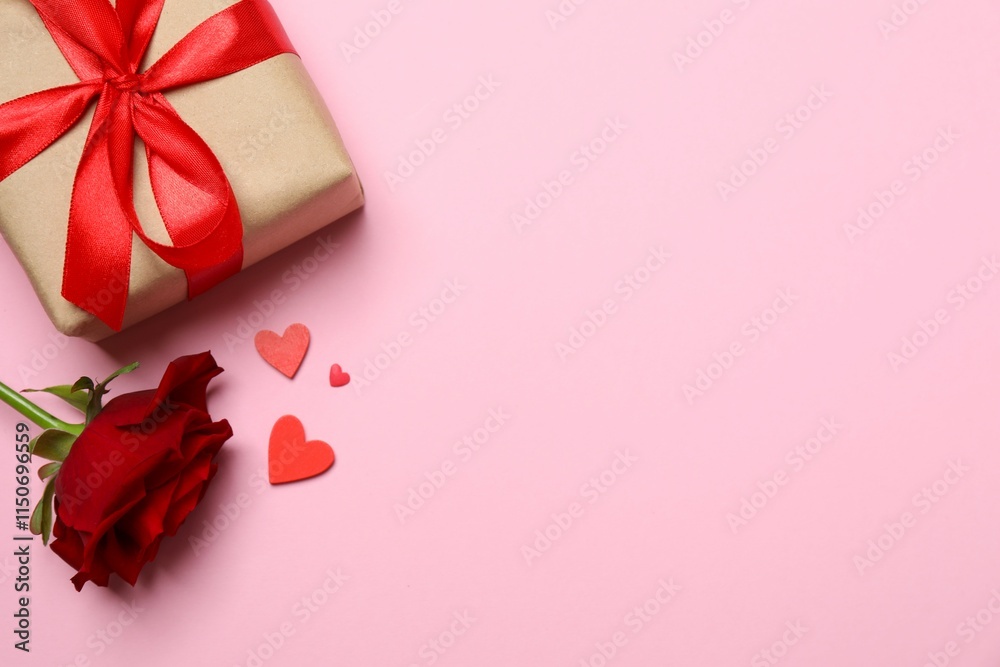 Red rose, gift box and hearts on color background