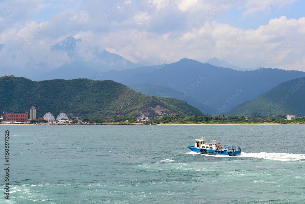 Fototapeta premium Coastal Scene with Boat and Dome Structure in Taiwan