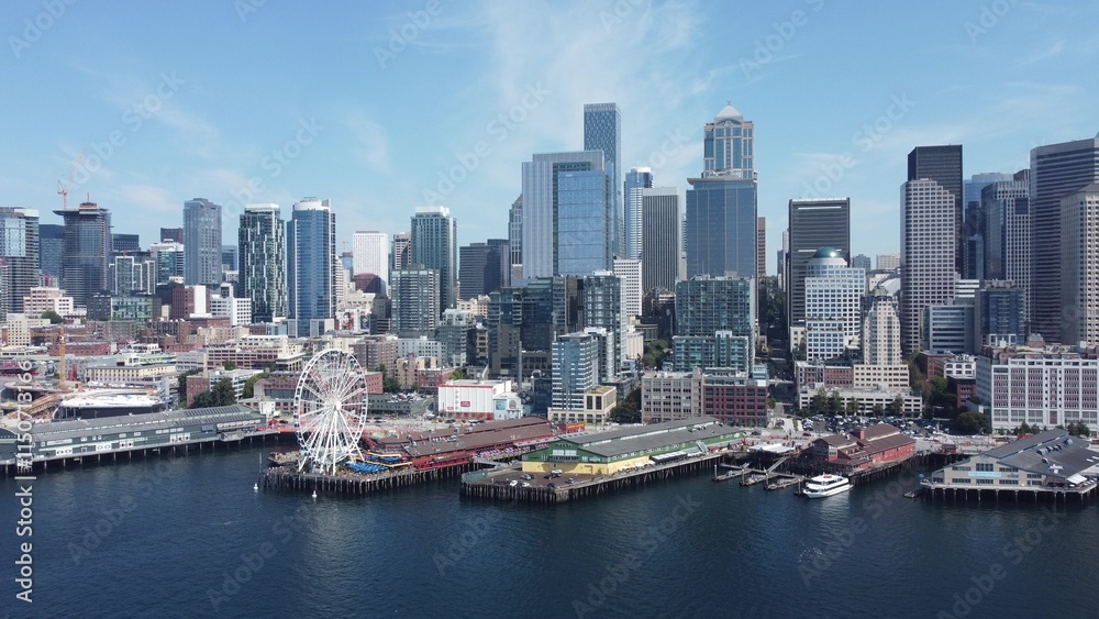 Aerial View of Modern City Skyline and Waterfront Ferris Wheel Aerial View of Modern City Skyline and Waterfront Ferris Wheel