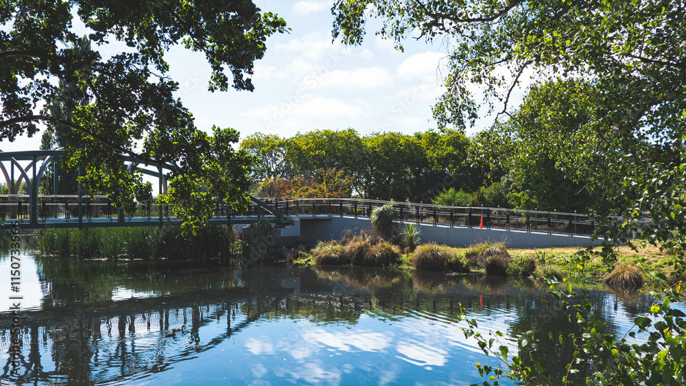Fototapeta premium Beautiful day at the park river blue skies water reflection Christchurch city New Zealand