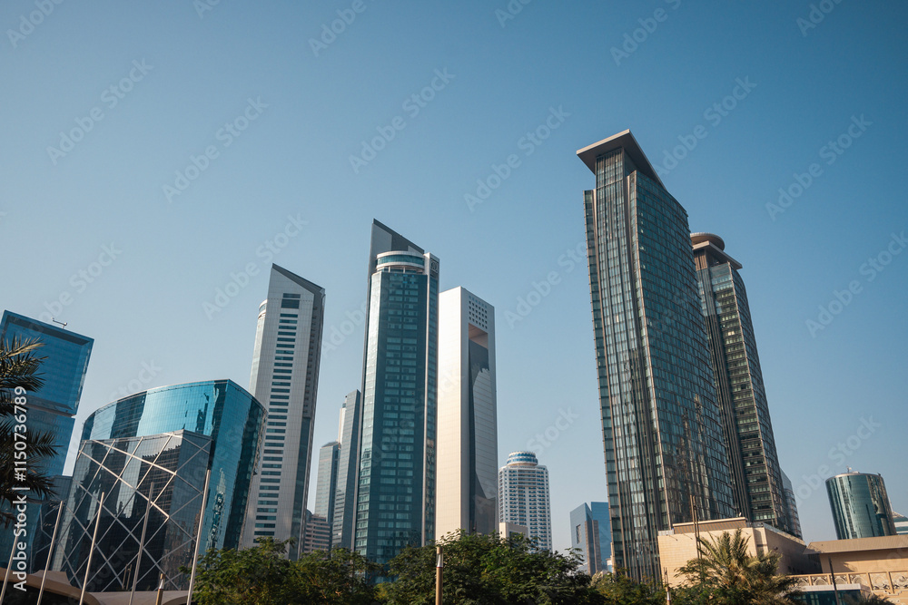 Bottom view of skyscrapers and tall buildings in Doha, Qatar with wide angle sky Bottom view of skyscrapers and tall buildings in Doha, Qatar with wide angle sky