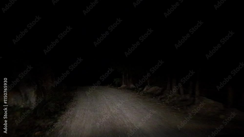 Driving dark road at night