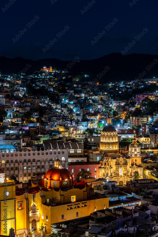 Naklejka premium Guanajuato city view with the Basilica Colegiata de Nuestra Senora de Guanajuato and Templo de la Compania Guanajuato at night