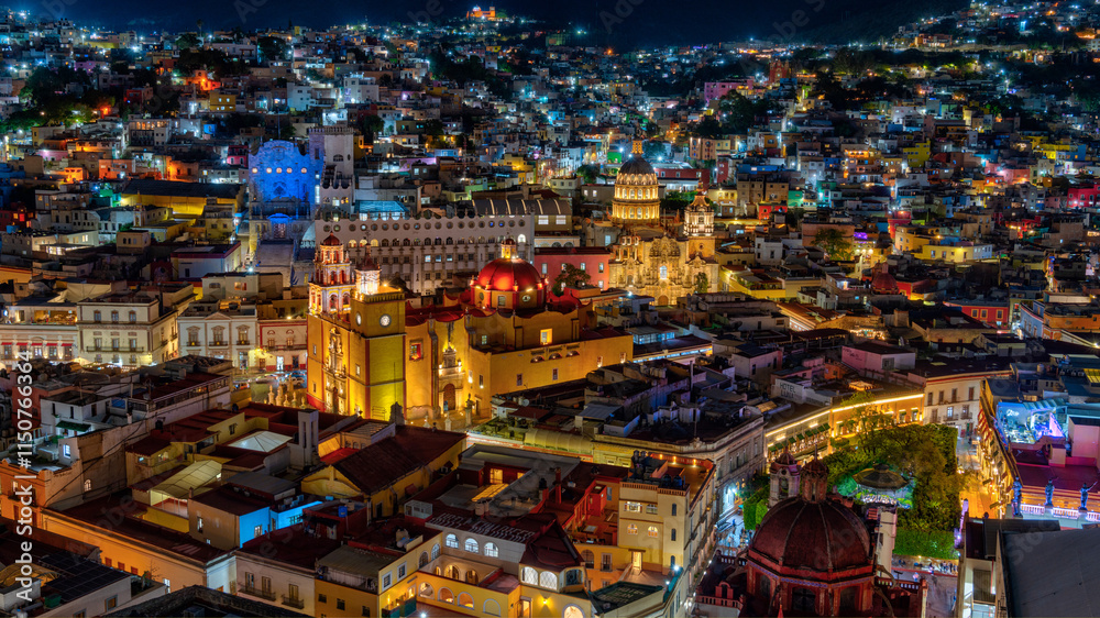 Naklejka premium Guanajuato city view with the Basilica Colegiata de Nuestra Senora de Guanajuato and Templo de la Compania Guanajuato at night