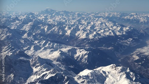 Top bird eye View from passenger porthole of beautiful landscape Flying airplane engine wing of plane fly on sunny cloudy day in winter. Transport, tourism, travel, flight, holidays vacation concept.