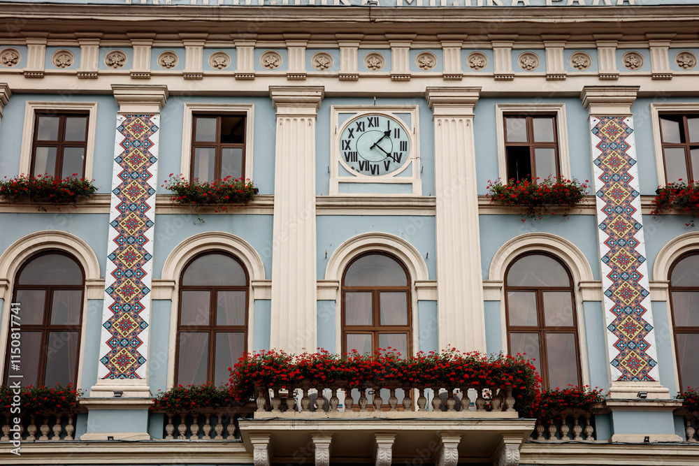 Obraz premium A clock tower with a clock face and a large window