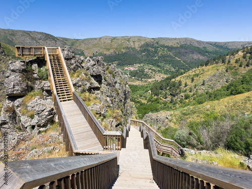 Landscape of the Mondego Walkways along the Mondego river valley with the surrounding Serra da Estrela cliffs. Caldeirao dam, Guarda, Portugal