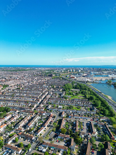 High Angle View of Downtown of Portsmouth City Centre Located at Beach and Sea Port Docks of England United Kingdom. Aerial Image Was Captured with Drone's Camera on May 15th, 2024. photo