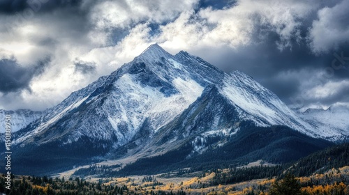 Majestic Snow-Capped Mountain Peak Under Dramatic Sky