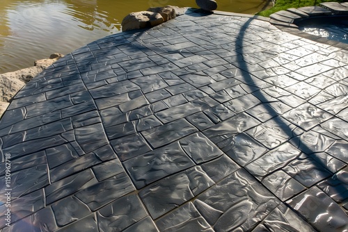 High-resolution image of stamped concrete featuring geometric patterns and natural stone-like texture.
