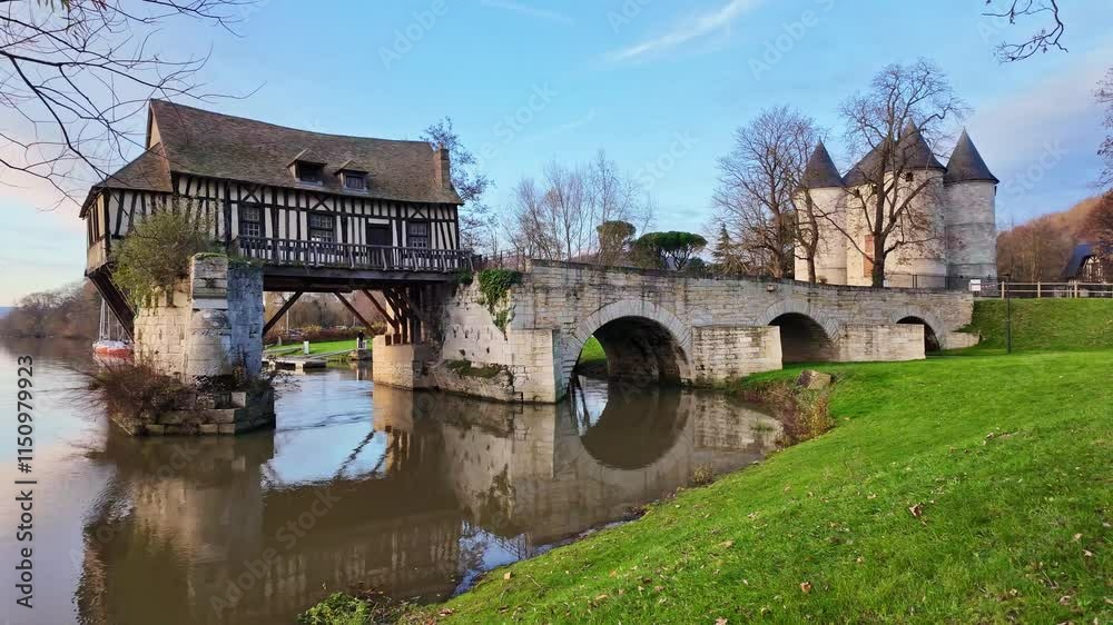 Peaceful moment about the historical Old Mill of Vernon in the town of Vernon in daytime, France. Peaceful moment about the historical Old Mill of Vernon in the town of Vernon in daytime, France.