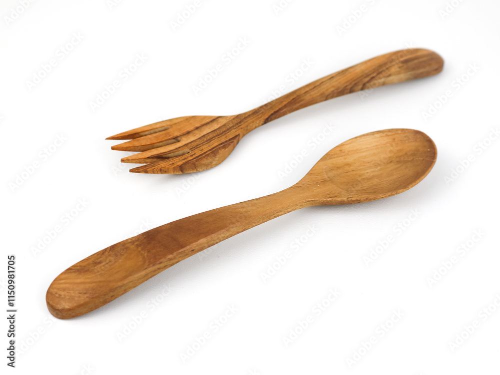 Wooden spoon and fork on a white isolated background. Wooden spoon and fork on a white isolated background.
