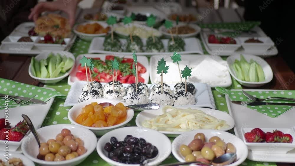 Festive table beautifully arranged with fruits and treats selection Festive table beautifully arranged with fruits and treats selection